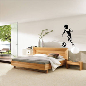 Soccer wall decal vinyl: black boy kicking a soccer ball silhouette