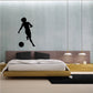 Soccer wall decal vinyl of a black soccer player kicking a ball