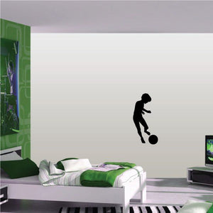 Soccer player wall vinyl decal, black silhouette kicking a soccer ball