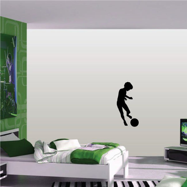 Soccer player wall vinyl decal, black silhouette kicking a soccer ball