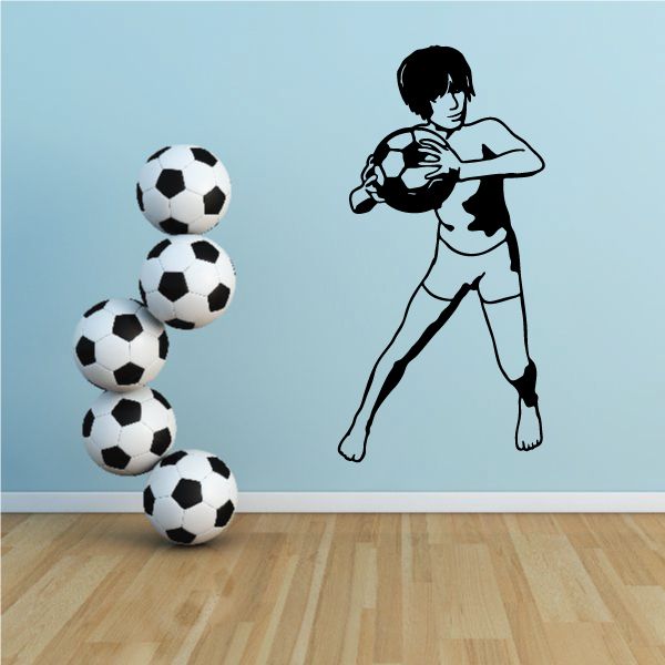 Soccer wall decal showing a running boy with soccer ball and stacked soccer balls