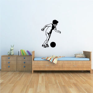 Soccer player wall decal with black silhouette kicking a soccer ball