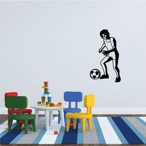 Soccer wall decal with black silhouette of a player dribbling a soccer ball