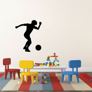 Black soccer player wall decal kicking a black ball, vinyl sticker