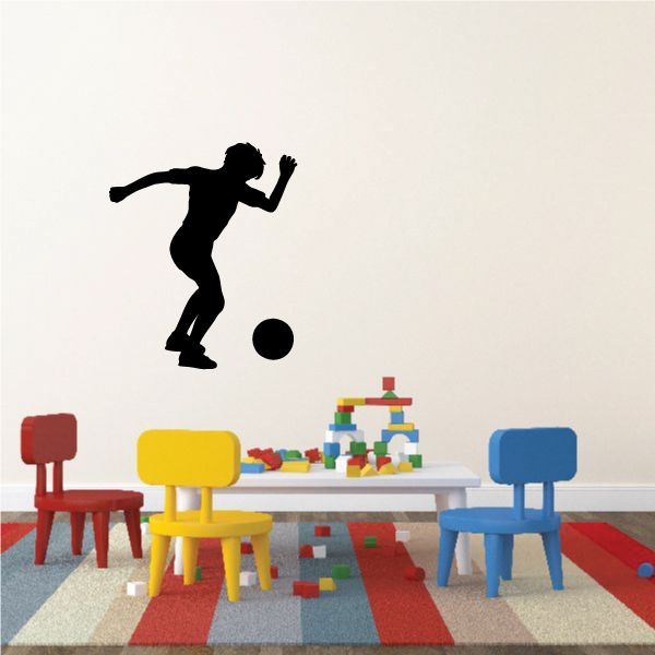 Black soccer player wall decal kicking a black ball, vinyl sticker