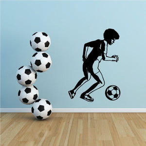 Soccer wall decal featuring running player silhouette and five black-and-white soccer balls