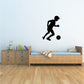 Soccer player wall decal, black vinyl silhouette kicking a ball