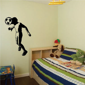 Soccer player vinyl wall decal silhouette holding a soccer ball