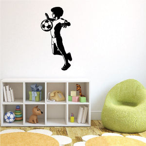 Soccer player wall decal, black vinyl silhouette kicking soccer ball