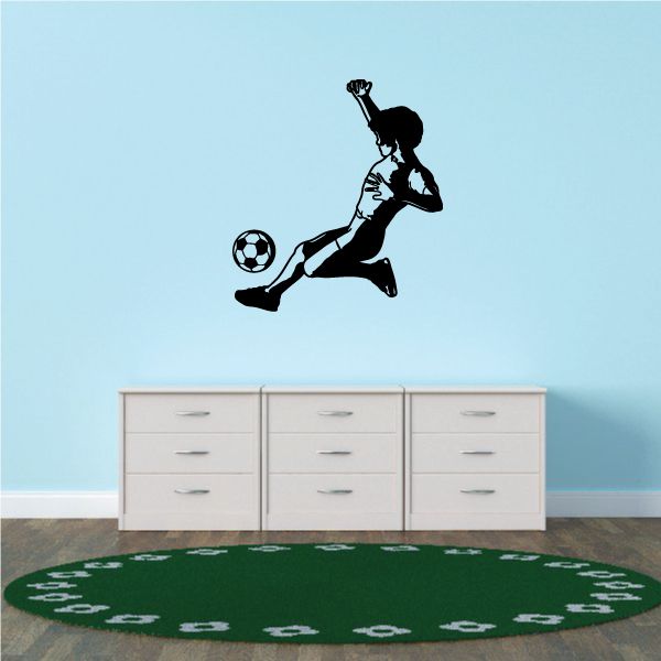 Soccer player vinyl wall decal kicking a soccer ball