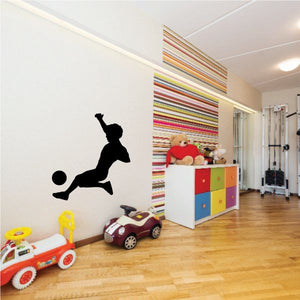 Black vinyl soccer player wall decal with ball silhouette