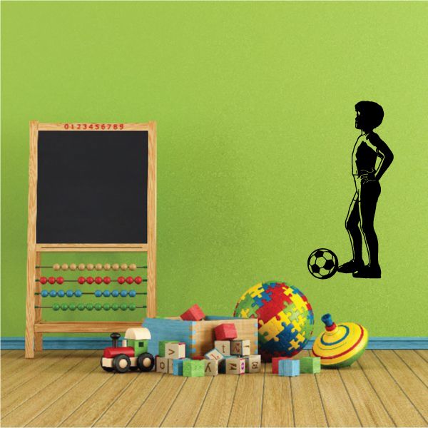 Black soccer player wall decal standing with soccer ball