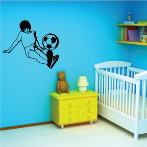 Soccer wall decal of a black player kicking a soccer ball