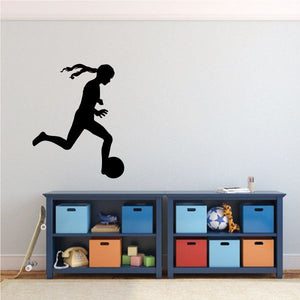 Black soccer player kicking ball wall decal silhouette