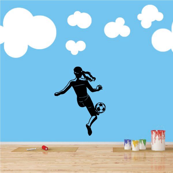 Soccer wall vinyl decal of a black soccer player kicking a ball