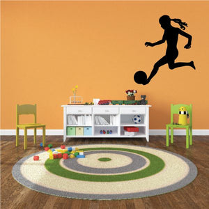Soccer wall decal, black player kicking soccer ball silhouette.