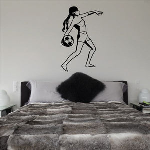 Soccer wall decal of a black player kicking a soccer ball