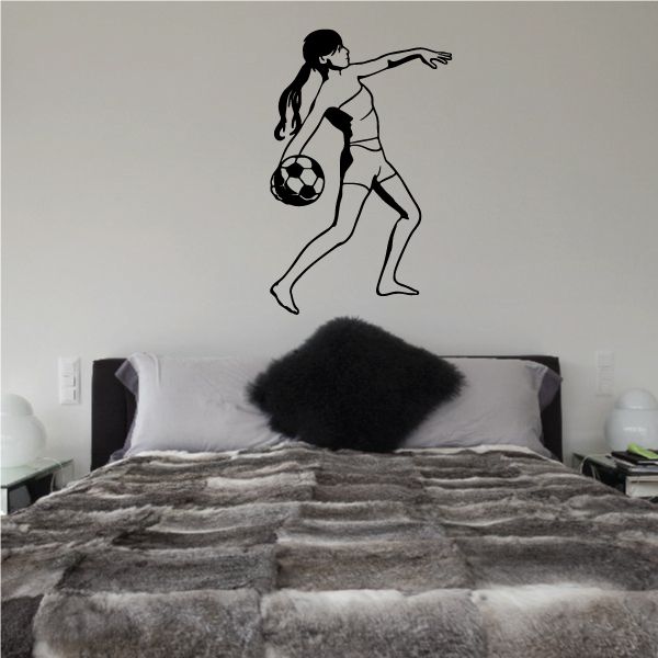 Soccer wall decal of a black player kicking a soccer ball
