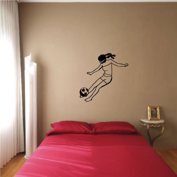 Soccer wall decal: black soccer player kicking a ball