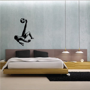 Soccer wall decal of a black player kicking a soccer ball