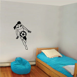 Soccer wall decal of a black soccer player dribbling a ball
