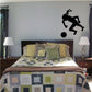 Black soccer player wall decal kicking a ball, vinyl sticker