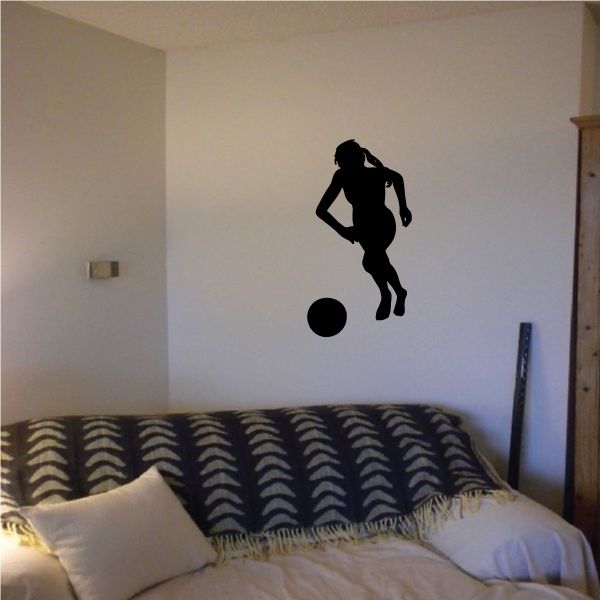 Soccer wall decal with black player silhouette and ball.