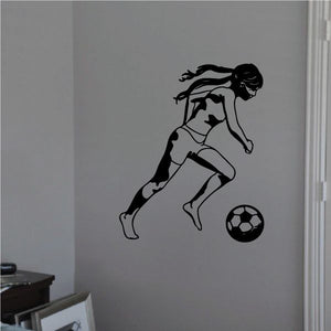 Soccer wall decal of a black player kicking a soccer ball, vinyl graphic