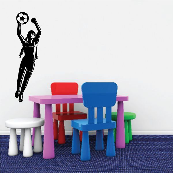 Black soccer player wall decal silhouette holding a soccer ball