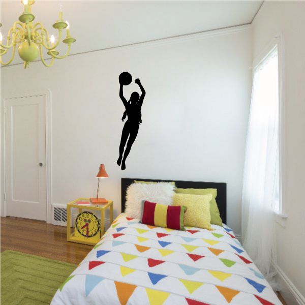Black soccer player wall decal silhouette, full-body kicking pose.