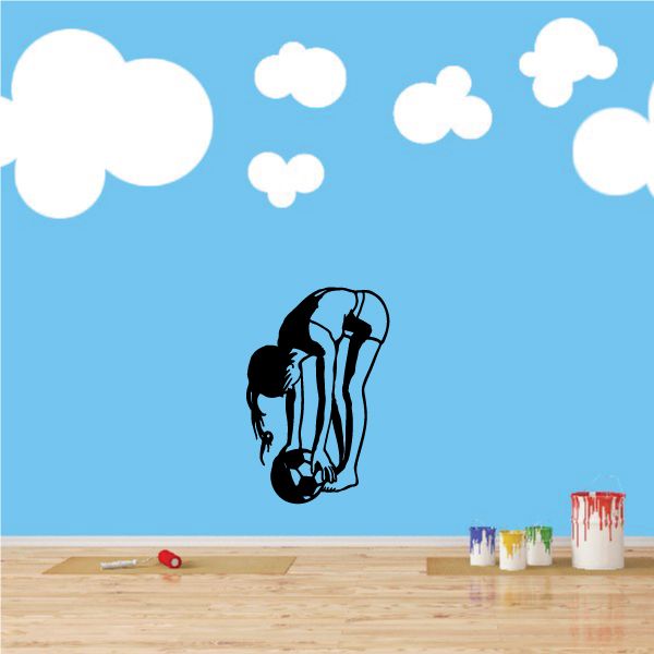Soccer wall decal of striped soccer player with ball