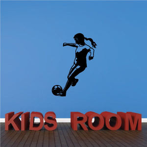 Soccer wall decal of black player kicking ball with 'KIDS ROOM' lettering