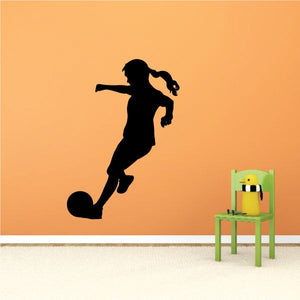 Soccer wall decal vinyl sticker of a black silhouette female soccer player kicking
