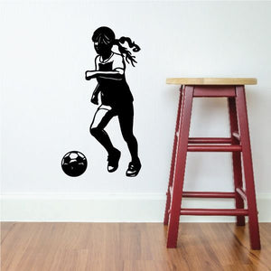 Soccer player vinyl wall decal, black silhouette of a girl kicking a soccer ball