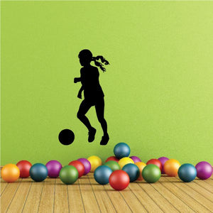 Soccer wall decal, black soccer player silhouette kicking ball with multicolor balls