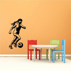 Soccer wall decal vinyl: black soccer player kicking a ball.