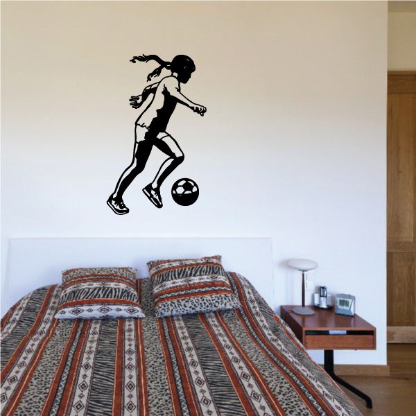 Soccer player vinyl wall decal, black silhouette with ball and dribbling pose