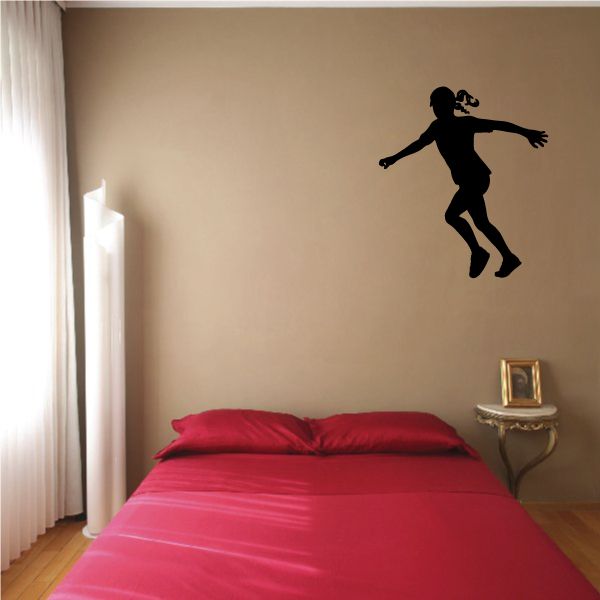 Soccer player wall decal, black vinyl silhouette in kicking pose
