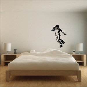 Soccer wall decal of a black soccer player kicking a ball