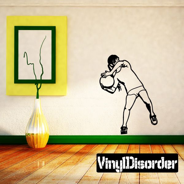 Soccer wall vinyl decal of a goalie holding a ball, black outline