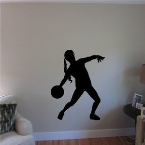 Soccer wall decal featuring black soccer player silhouette with a ball