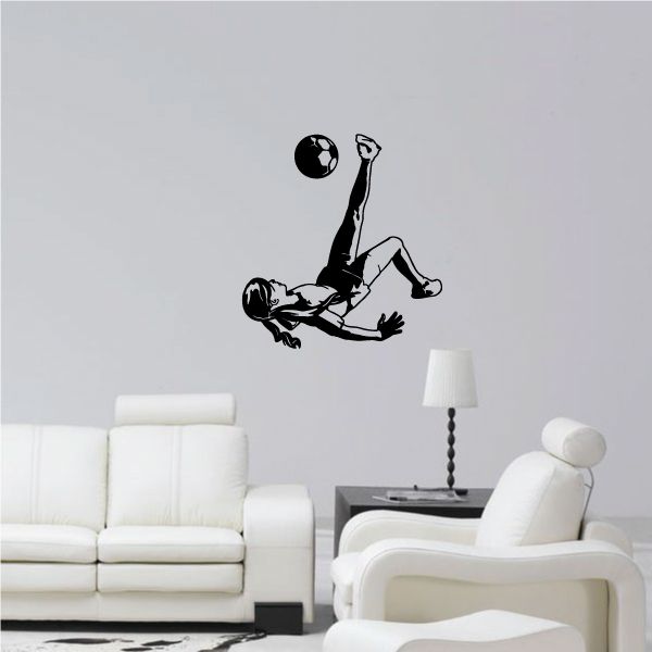 Soccer wall decal of black soccer player kicking a ball, vinyl wall art