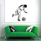 Soccer wall decal of a black soccer player kicking a ball with bold outlines