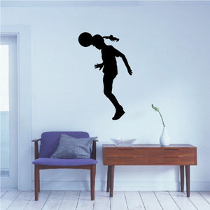 Soccer player wall decal, black vinyl silhouette kicking a ball