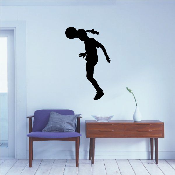 Soccer player wall decal, black vinyl silhouette kicking a ball