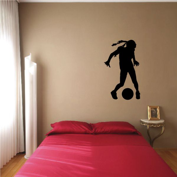 Soccer player wall decal, black vinyl silhouette kicking a ball