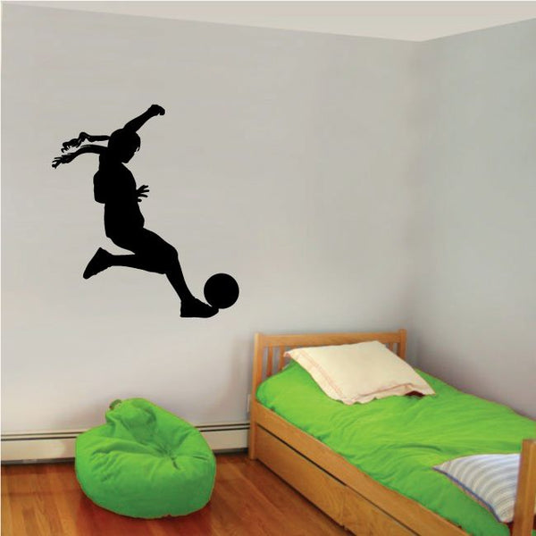 Soccer wall decal vinyl of a black silhouette soccer player kicking a ball