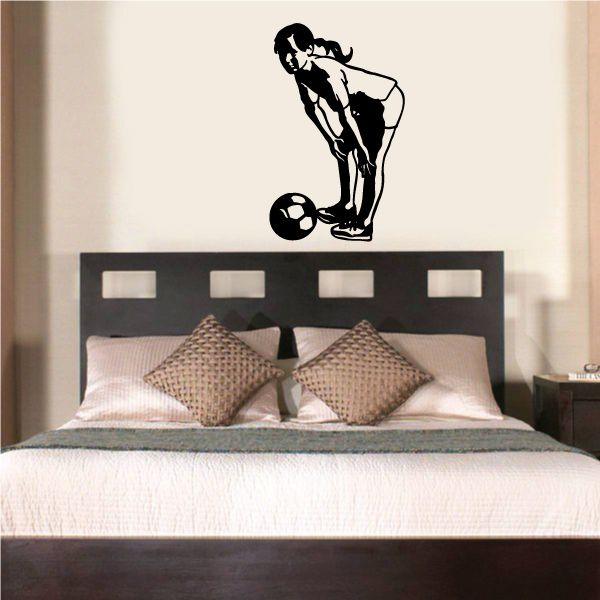 Vinyl soccer player wall decal with ball in kicking pose