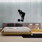 Soccer player wall decal, black vinyl silhouette holding a ball