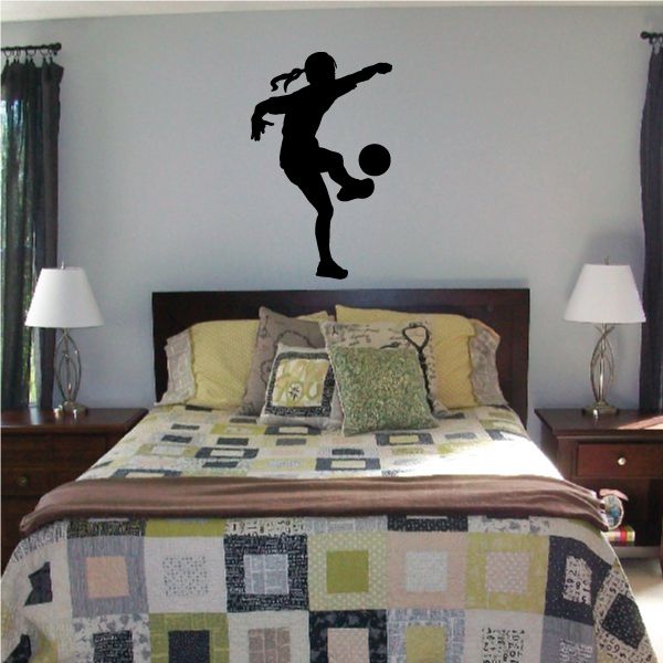 Soccer player wall decal, black vinyl silhouette in kicking pose